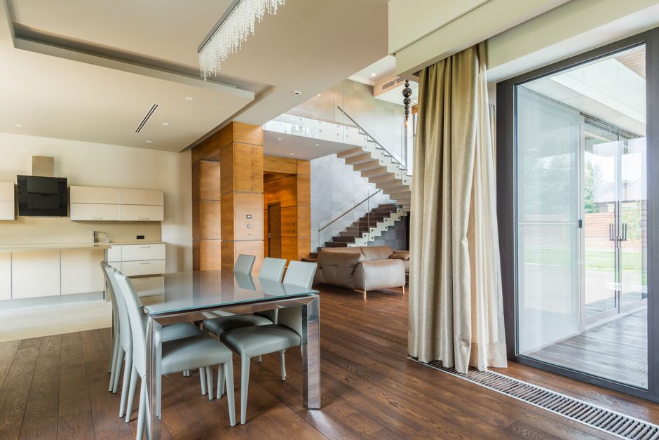 Herringbone wood floor in a bright dining room